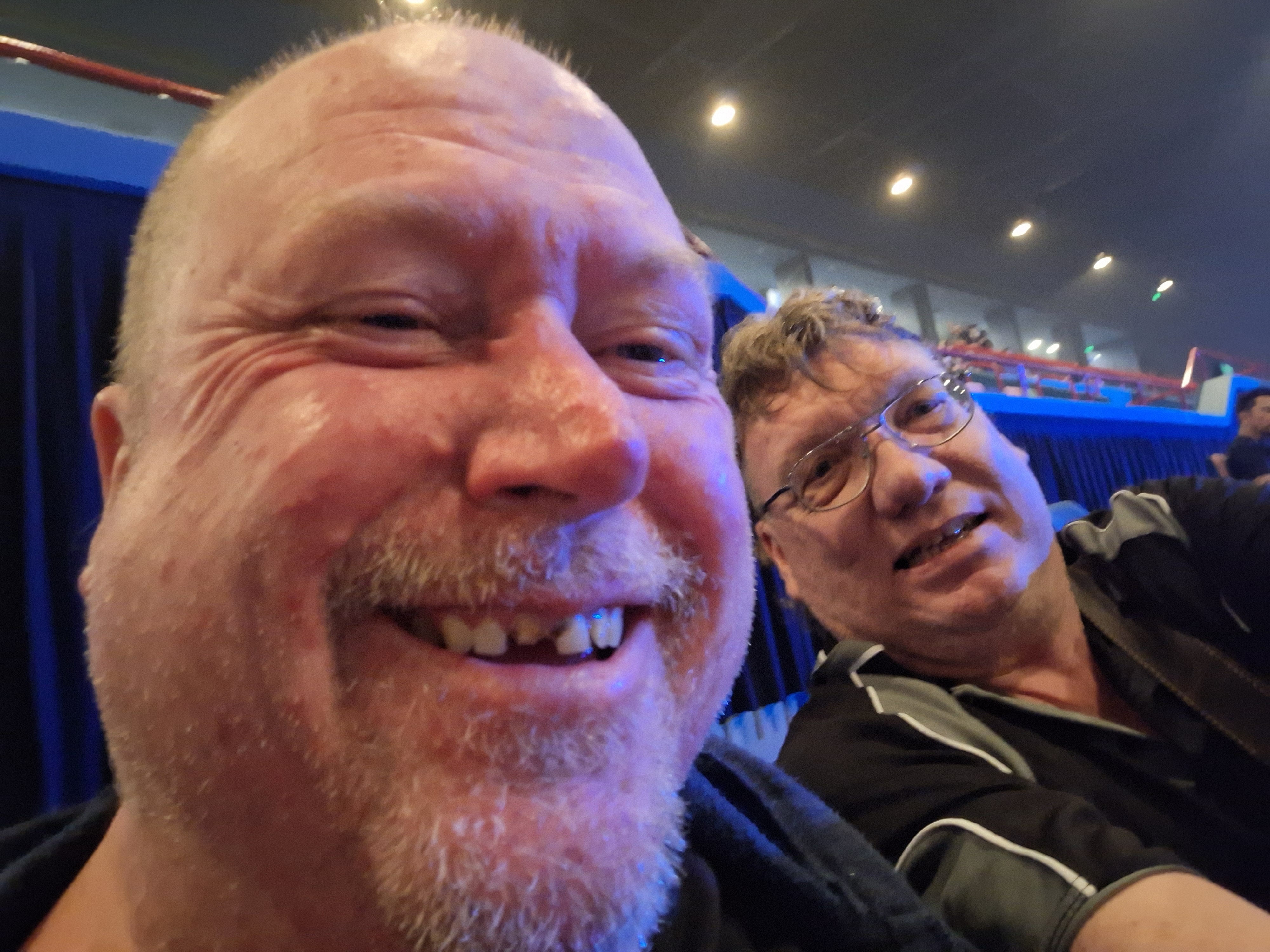 Jay and his support worker having a great time at concert